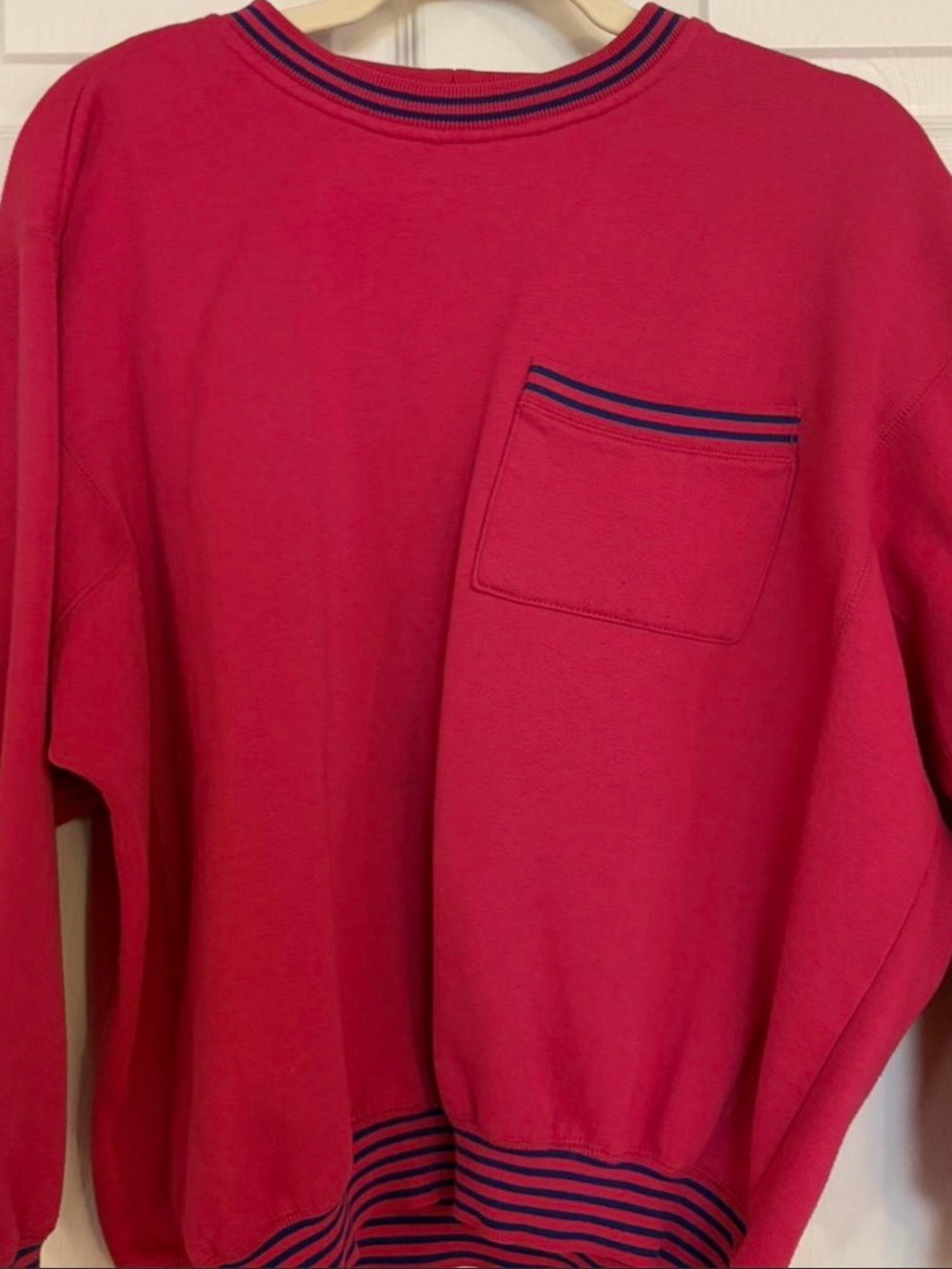 hot pink crewneck with blue striped detailing